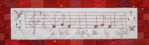 1l christmas carols quilt close up